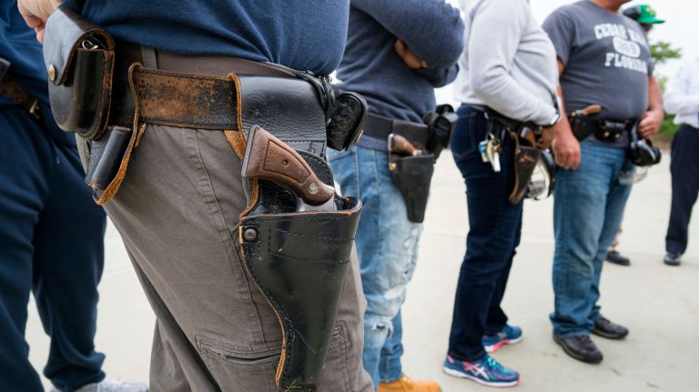 NYPD officers wear their revolvers at Rodman's neck gun range in the Bronx on May 30, 2018, but later trained on 9mm firearms.