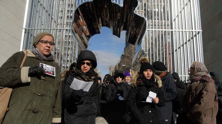 Immigration rights activists participate in a Jericho walk around Ai Weiwei's 