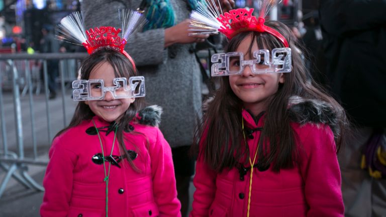 New Year's Eve Times Square ball drop: See photos 39 6 -year-old twins Penny and Abby Philip of East Harlem pose for a picture in Times Square on New Year's Eve on Saturday, Dec. 31, 2016.