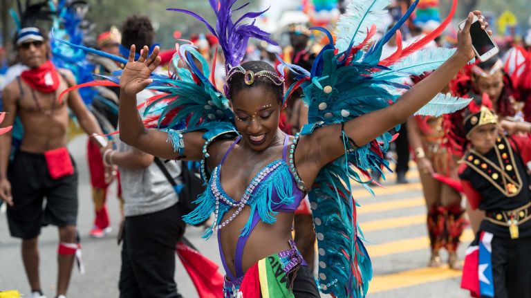 Costumed dancers march in the West Indian Day Parade along Eastern Parkway in Brooklyn on Monday, Sept. 5, 2016.