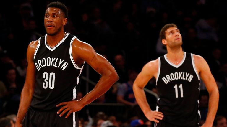 
Thaddeus Young #30 and Brook Lopez #11 of the Brooklyn Nets look on in the second half against the New York Knicks at Madison Square Garden on Friday, Dec. 4, 2015 in New York City.