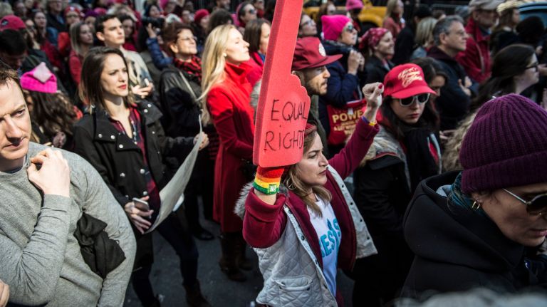 People take part in the A Day Without a Woman rally in Manhattan on International Women's Day on March 8, 2017.
