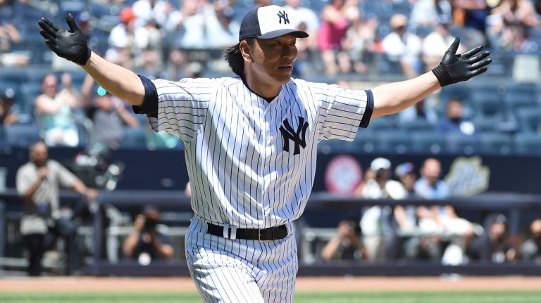 Former New York Yankees player Hideki Matsui reacts after his two-run home run during the 70th annual Old-Timers' game at Yankee Stadium on Sunday, June 12, 2016.