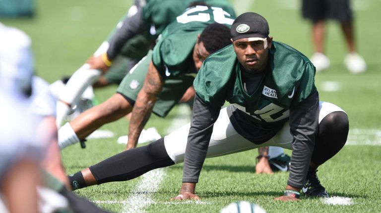 New York Jets safety Ronald Martin stretches during warmups at Organized Team Activities at the Jets Training Center on Wednesday, May 25, 2016.