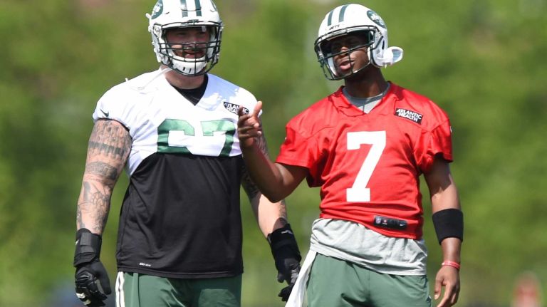 New York Jets quarterback Geno Smith talks with Jets guard Brian Winters during Organized Team Activities at the Jets Training Center on Wednesday, May 25, 2016.