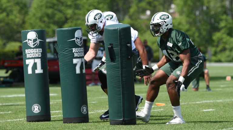 New York Jets linebacker Jordan Jenkins, right, and teammates run drills during Organized Team Activities at the Jets Training Center on Wednesday, May 25, 2016.