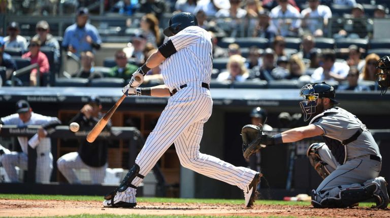 Yankees vs. Rays 62 New York Yankees right fielder Carlos Beltran singles against the Tampa Bay Rays during the first inning of an MLB baseball game at Yankee Stadium on Sunday, April 24, 2016.