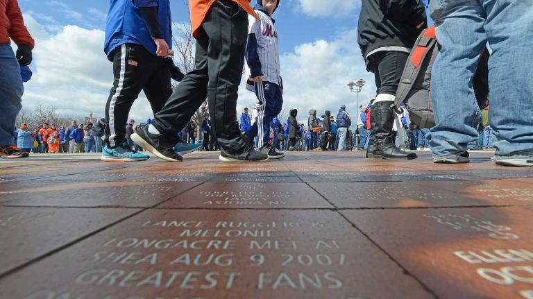 The crowds arrive at Citi Field for the Mets' home opener against the Philadelphia Phillies on Friday, April 8, 2016.