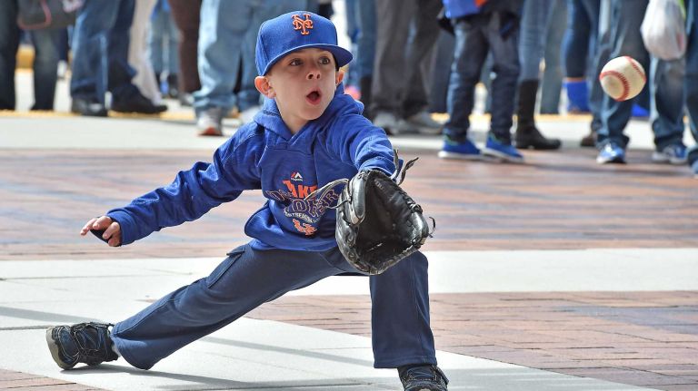 Max Velez, 7, of Suffren, plays catch before the Mets' home opener against the Philadelphia Phillies on Friday, April 8, 2016, at Citi Field.