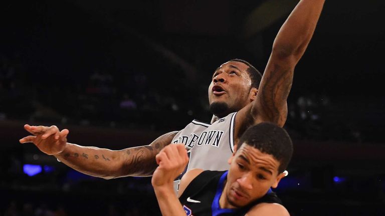 Georgetown guard D'Vauntes Smith-Rivera (4) attempts a shot past DePaul guard Billy Garrett Jr. (5) during the Big East Tournament at Madison Square Garden in New York, New York on Wednesday, Mar 9, 2016.