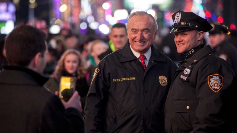 New Year's Eve in NYC 2015 to 2016: Pictures of the ball drop in Times Square and more 45 Police Commissioner William Bratton takes a picture with an officer during the New Year's Eve event in Times Square in Manhattan, on Dec. 31, 2015.