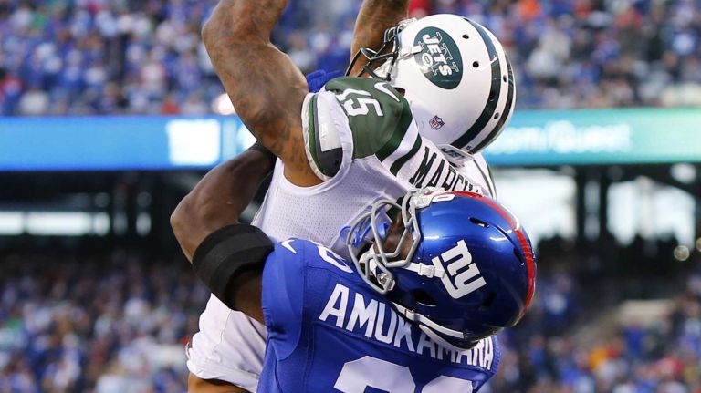 Brandon Marshall #15 of the New York Jets hauls in a touchdown late in the fourth quarter against Prince Amukamara #20 of the New York Giants at MetLife Stadium on Sunday, Dec. 6, 2015 in East Rutherford, N.J.