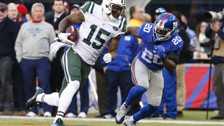 Brandon Marshall #15 of the New York Jets runs with the ball after making a catch against Prince Amukamara #20 of the New York Giants at MetLife Stadium on Sunday, Dec. 6, 2015 in East Rutherford, N.J.