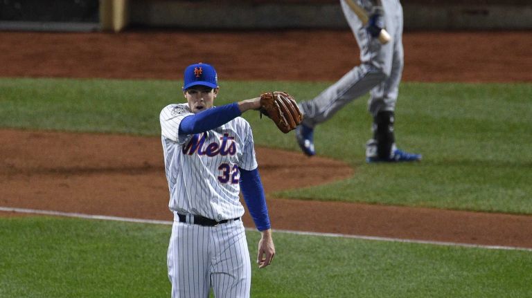 New York Mets starting pitcher Steven Matz reacts as Kansas City Royals center fielder Lorenzo Cain walks to the dugout after he strikes out looking during Game 4 of the World Series against the Kansas City Royals at Citi Field on Saturday, Oct. 31, 2015.