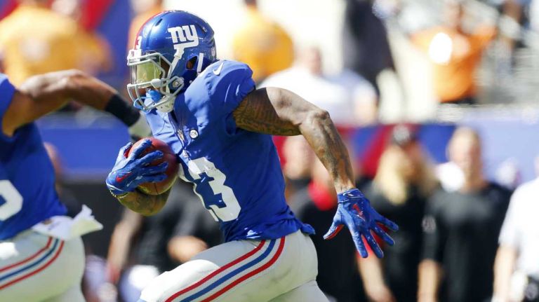 Odell Beckham #13 of the New York Giants runs the ball to the end zone for a touchdown in the first half of a game against the Atlanta Falcons at MetLife Stadium on Sunday, Sept. 20, 2015.