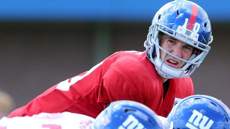 New York Giants quarterback Eli Manning lines up behind center during training camp at the Quest Diagnostics Training Center in East Rutherford, N.J., on Sunday, Aug. 2, 2015.