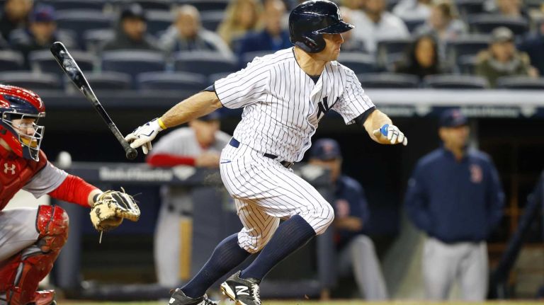 Brett Gardner follows through on a fourth inning hit against the Boston Red Sox at Yankee Stadium on Sunday, Apr. 12, 2015.