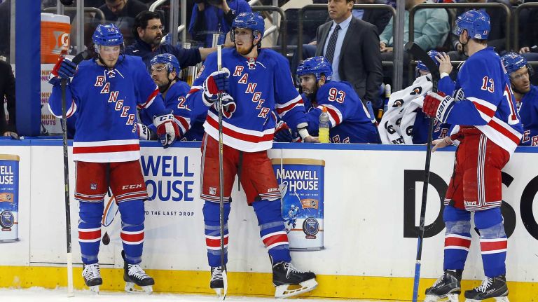 Matt Hunwick, Marc Staal and Kevin Hayes of the New York Rangers look on at the bench in the second period against the Pittsburgh Penguins during Game 5 of the Eastern Conference Quarterfinals at Madison Square Garden on Friday, April 24, 2015.
