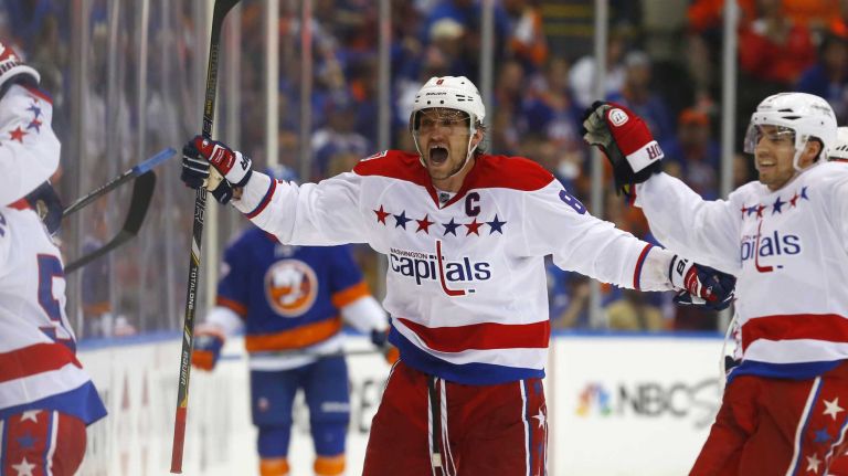 Alex Ovechkin #8 of the Washington Capitals celebrates a third-period game-tying goal against the New York Islanders scored by teammate Nicklas Backstrom (not pictured) during Game 3 of the Eastern Conference quarterfinals at Nassau Coliseum on Sunday, April 19, 2015.