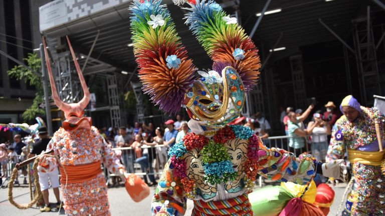 Dominican Day Parade brings color to a cloudy New York City 12 Disney's Elsa showed up on this performer's costume.