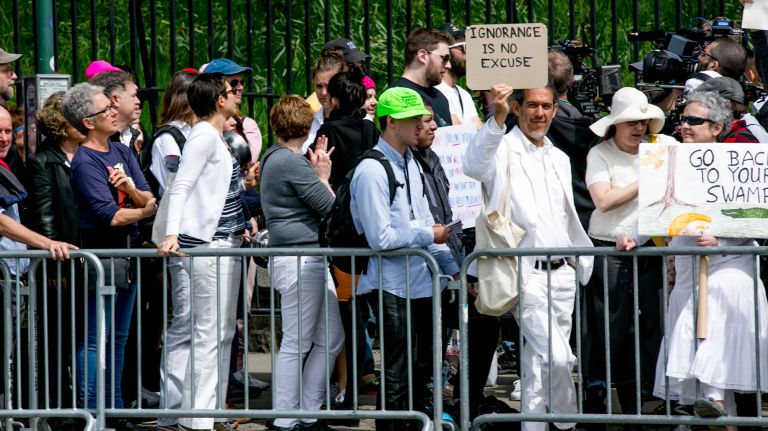 Protesters fill De Wittt Clinton Park on 54th Street ahead of President Donald Trump's arrival at the Intrepid Sea, Air & Space Museum on Thursday, May 4, 2017. 