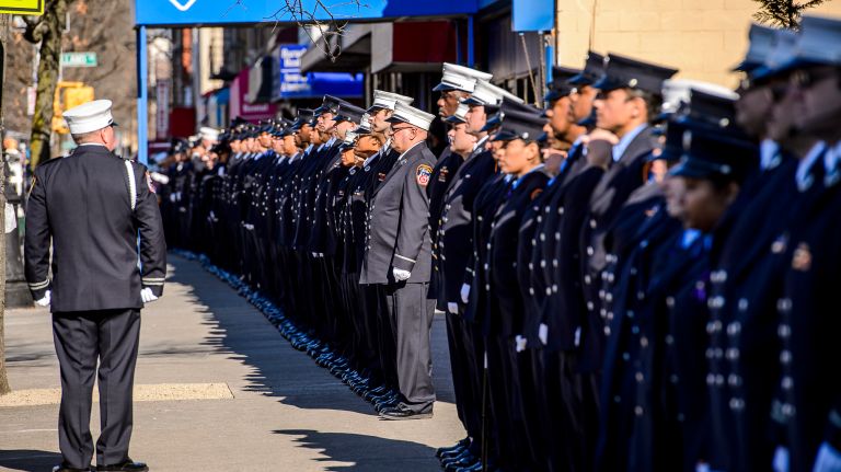 FDNY firefighters line up as family members leave the wake for Yadira Arroyo at the Joseph A. Lucchese Funeral Home on Morris Park Avenue in the Bronx, Thursday, March 23, 2017.