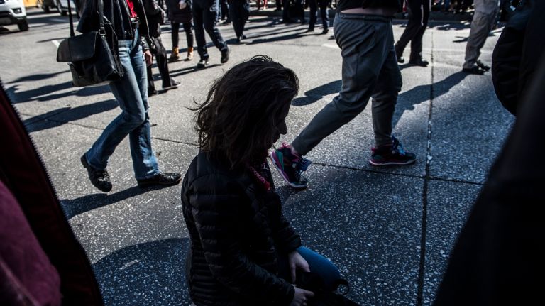 A woman engages in civil disobedience in Manhattan's Columbus Circle during the A Day Without a Woman rally on International Women's Day on March 8, 2017.