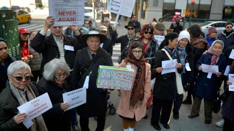 About two dozen people marched from Columbus Circle in Manhattan to the Japanese American Church on 7th Ave. on Saturday, Feb. 18, 2017 to commemorate the Japanese Americans who were held in concentration camps on U.S. soil 75 years ago after President Franklin D. Roosevelt signed executive order 9066 in 1942. Here the marchers are seen as they meet some of the remaining internment survivors. The executive order authorized the U.S. military to remove 120,000 people of Japanese descent from their homes on the west coast to inland concentration camps. Most were U.S. citizens at the time of their internment. The march commemorated the day the executive order was signed and was a show of solidarity with Muslim Americans who fear the next executive order could potentially ban them from the U.S.