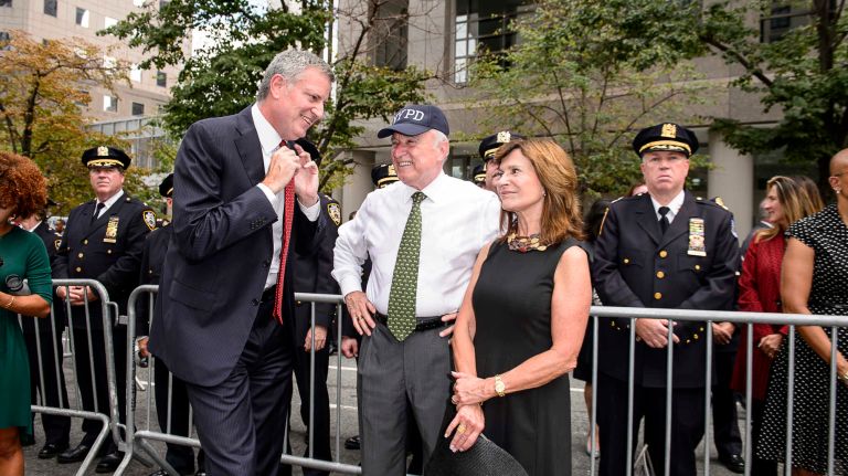 From left, Mayor Bill de Blasio, NYPD Commissioner William Bratton and his wife, Rikki Klieman, at the parade and ceremony on Friday, Sept. 9, 2016, to honor NYPD officers who died in the 9/11 terror attacks.