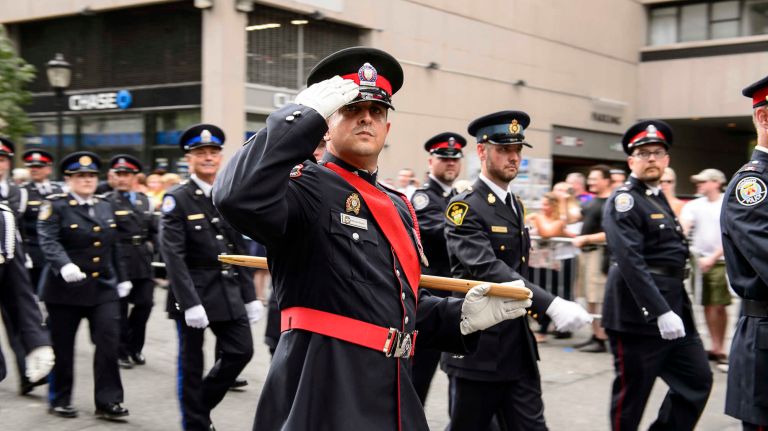 Canadian police officers march in the parade to honor NYPD officers who died in the 9/11 terror attacks, on Friday, Sept. 9, 2016. 