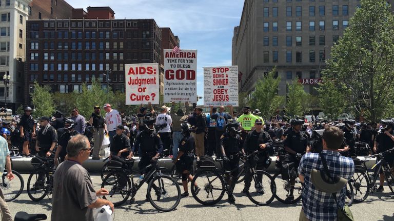 Police officers surround demonstrators in Cleveland Public Square on Wednesday, July 20, 2016,m near the Republican National Convention in the Quicken Loans Arena.