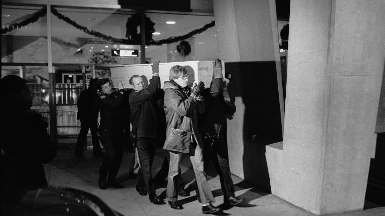 Police and emergency crews remove the body of one of the bomb blast victims from the main terminal building at LaGuardia Airport on Dec. 29, 1975. The bombing was the deadliest act of terror in the city before Sept. 11, 2001, killing 11 people and leaving 75 injured. 