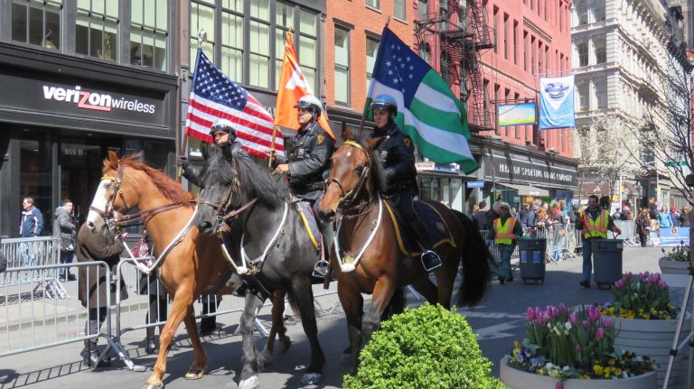 Police horses lead the first NYC Paws Parade and Adoptapalooza, organized by the ASPCA and the Mayor's Alliance for NYC's Animals, on April 10, 2016.