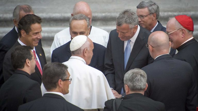 Gov. Andrew M. Cuomo, Sen. Chuck Schumer and New York City Mayor Bill de Blasio greet Pope Francis as he arrives at St. Patrick's Cathedral in Manhattan on Sept. 24, 2015.