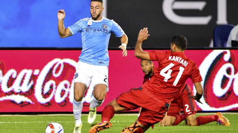 New York City FC defender RJ Allen is defended by Toronto FC defender Ahmed Kantari in an MLS game at Yankee Stadium on Wednesday, Sept. 16, 2015.