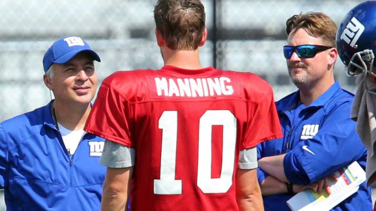 New York Giants quarterbacks coach Mike Sullivan, left, works with quarterback Eli Manning, offensive coordinator Ben McAdoo and quarterback Ricky Stanzi during training camp at the Quest Diagnostics Training Center in East Rutherford, N.J., on Wednesday, Aug. 5, 2015.