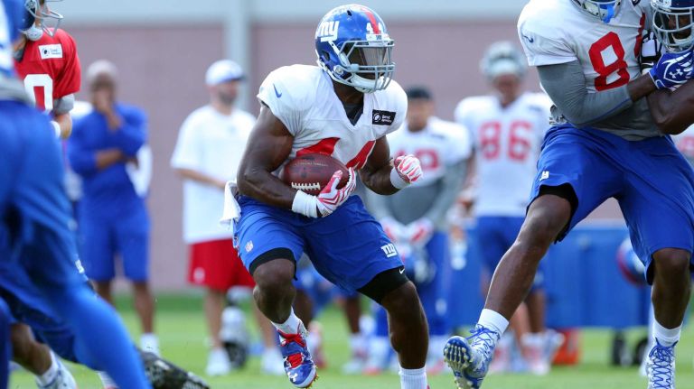 New York Giants running back Andre Williams #44 runs the ball during training camp at the Quest Diagnostics Training Center in East Rutherford, N.J., on Sunday, Aug. 2, 2015.