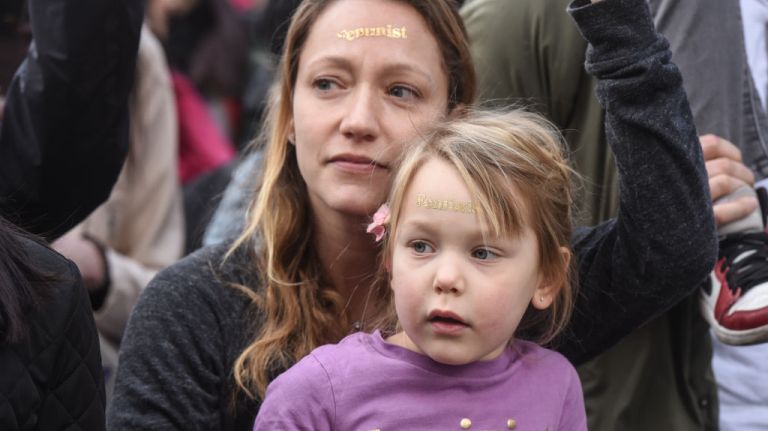 Women's March on NYC: Photos of the 2nd annual demonstration 27 A young girl wears a