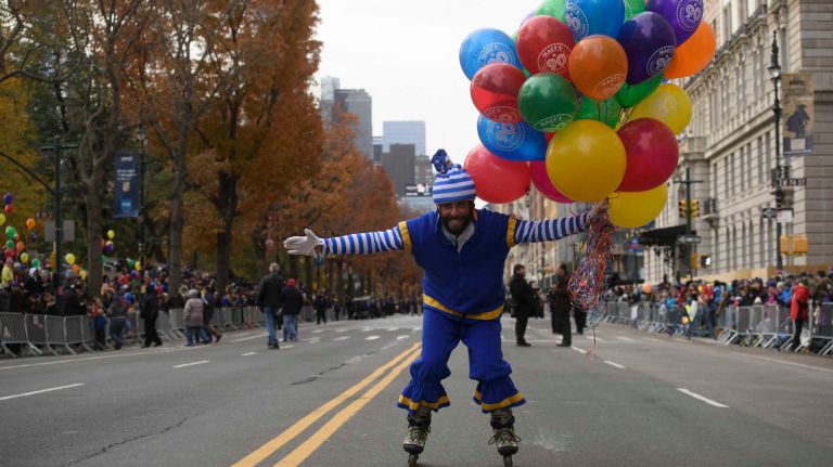 A clown livens up the crowd along Central Park West on Thursday, Nov. 24, 2016, at the start of the 90th annual Macy's Thanksgiving Day Parade in Manhattan.