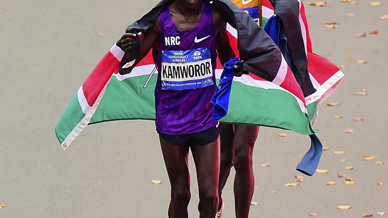 Stanley Biwott and Geoffrey Kamworor of Kenya celebrate their one-two finish in the Men's New York City Marathon in Manhattan on Sunday, Nov. 1, 2015.