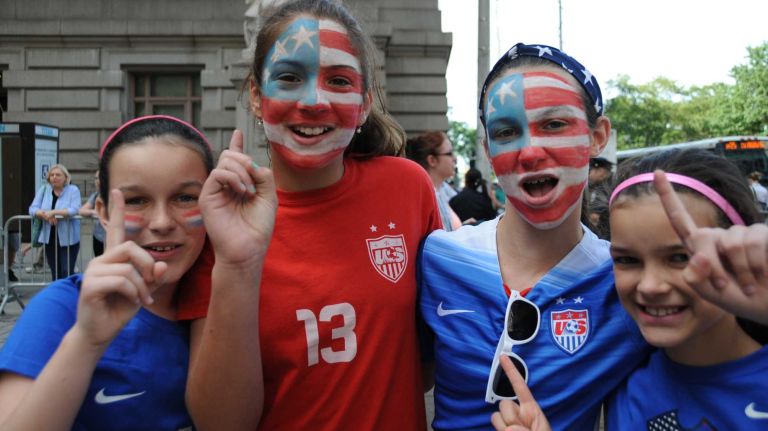 Erin Welch 11, left, Sophia Nelson, 12, Bridget Welch 13, and Deirdre Welch 9, all of East Islip, cheer as they wait for the World Cup champion U.S. Women's Soccer Team's ticker-tape parade to start along the Canyon of Heroes in lower Manhattan on Friday, July 10, 2015.
