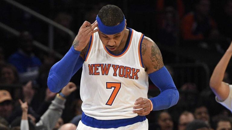 New York Knicks forward Carmelo Anthony reacts after sinking a three-pointer against the New Orleans Pelicans in the first half of an NBA game at Madison Square Garden on Monday, Jan. 19, 2015.