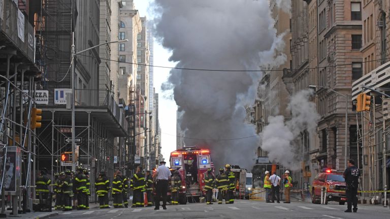 Fifth Avenue fills with smoke after steam pipe explodes: Photos 8 Firefighters respond after steam billows from a pipe that exploded Thursday on Fifth Avenue in Manhattan.