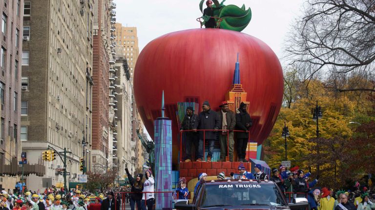 The hip-hop trio, De La Soul, rides the Big Apple float on Nov. 24, 2016, as the 90th annual Macy's Thanksgiving Day Parade steps off along Central Park West in Manhattan.