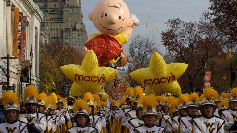 The Charlie Brown balloon floats above Central Park West as the 90th Macy's Thanksgiving Day Parade in Manhattan steps off Thursday, Nov. 24, 2016.
