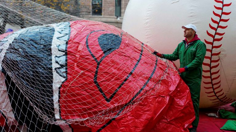 A crew member helps inflate the Red Mighty Morphin Power Ranger balloon on West 77th Street on Wednesday, Nov. 23, 2016, a day before the 90th Macy's Thanksgiving Day Parade in Manhattan.