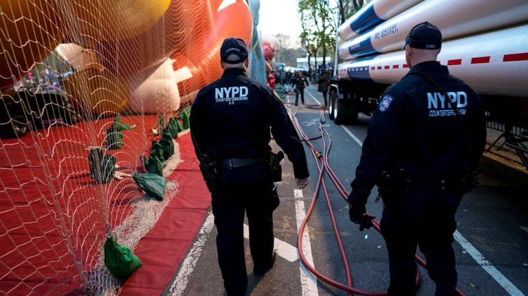 NYPD counterterrorism officers patrol West 77th Street as parade balloons are inflated on Wednesday, Nov. 23, 2016, a day before the 90th Macy's Thanksgiving Day Parade in Manhattan.