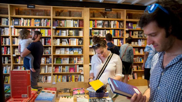 Customers browse books at Books Are Magic in Brooklyn, as the bookstore held a soft opening on April 29, 2017. The bookstore officially opens on May 1, 2017.