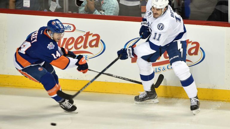 New York Islanders defenseman Thomas Hickey (14) and Tampa Bay Lightning center Brian Boyle (11) battle for puck in the first period in Game 3 of the Eastern Conference semifinals on Tuesday, May 3, 2016 at Barclays Center.