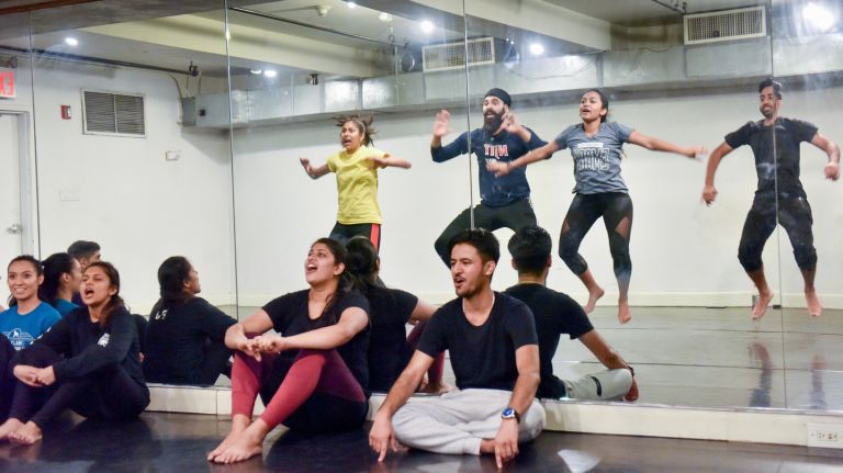Though dancers traditionally perform in vibrant multicolored outfits, college T-shirts were popular at the practice on Jan. 21, 2018.